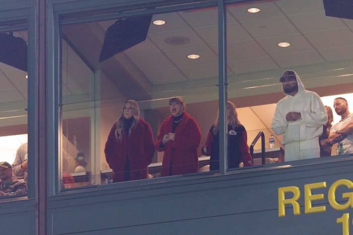 Dec 3, 2023; Green Bay, Wisconsin, USA; Taylor Swift, center, cheers during the third quarter of the game between the Kansas City Chiefs and Green Bay Packers at Lambeau Field.